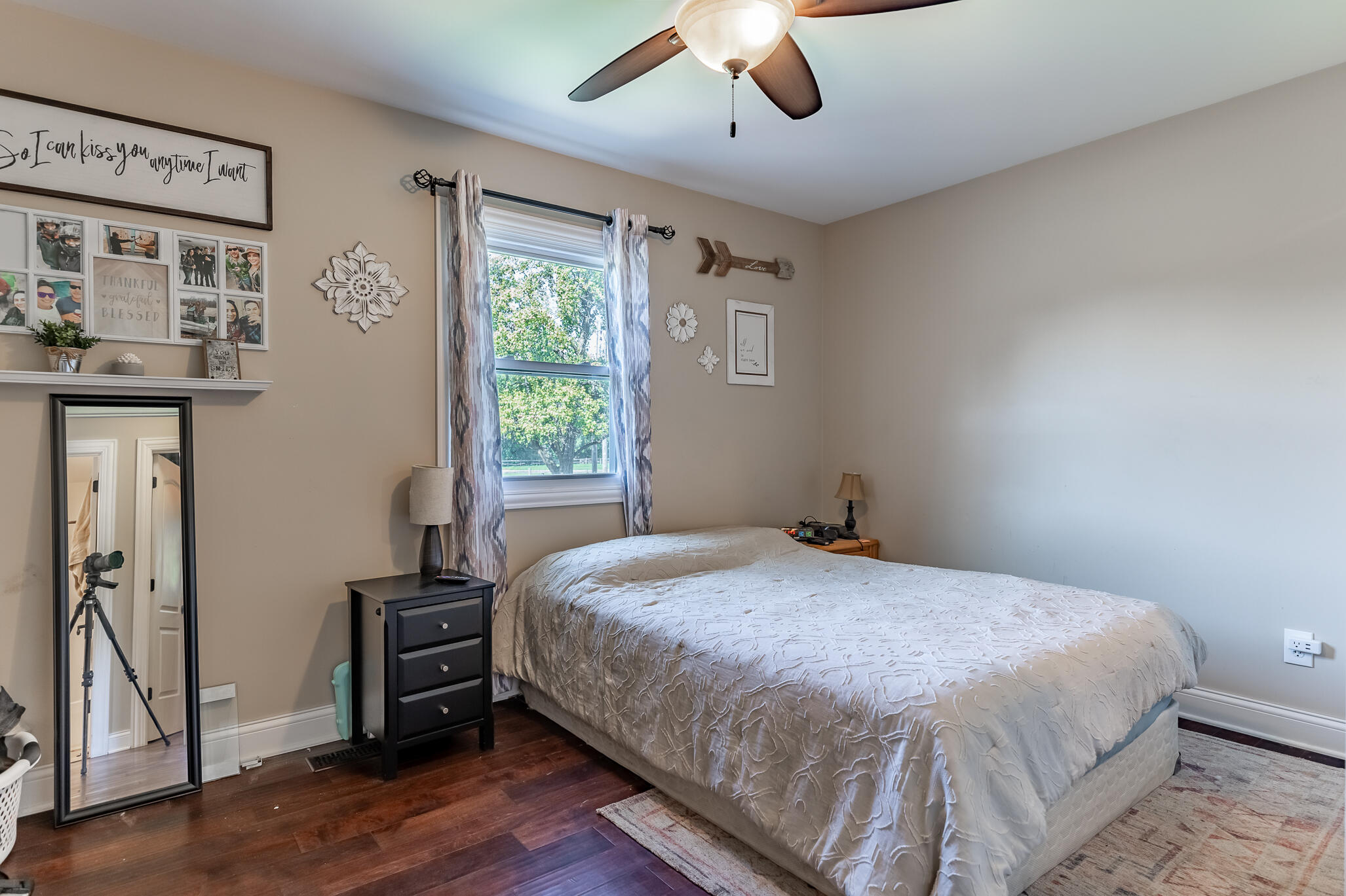 14615 Reeder Road Crown Point, IN 46307 - Photo 10 of 26 a bedroom with a bed and a chandelier