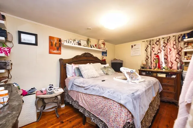 a bedroom with bed and a couch