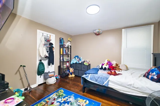 a room with toys and a wooden floor