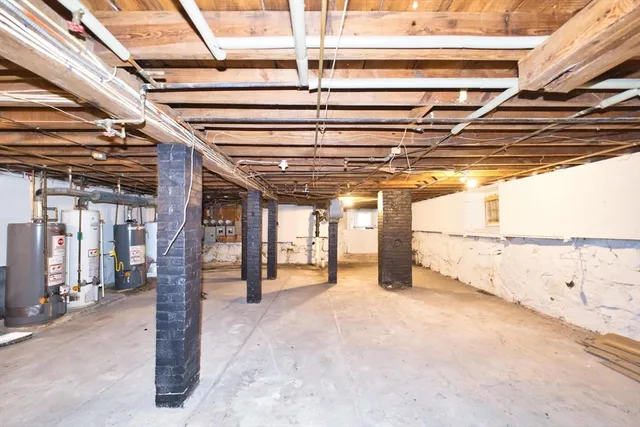 a wooden bench sitting in front of a building
