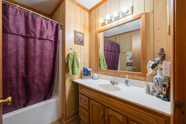 a bedroom with a bed and a view of bathroom