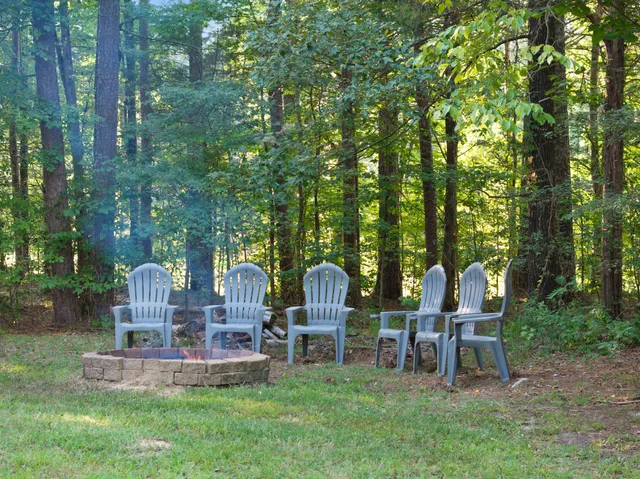 a view of a chair and table in the patio