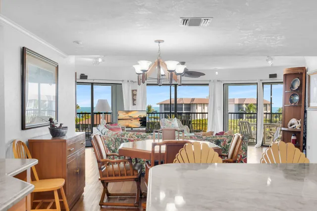a kitchen with stainless steel appliances granite countertop a sink refrigerator and cabinets