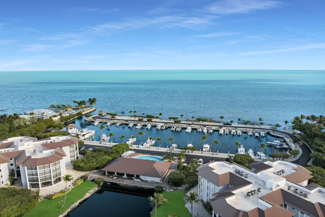 a open kitchen with a sink and wooden floor