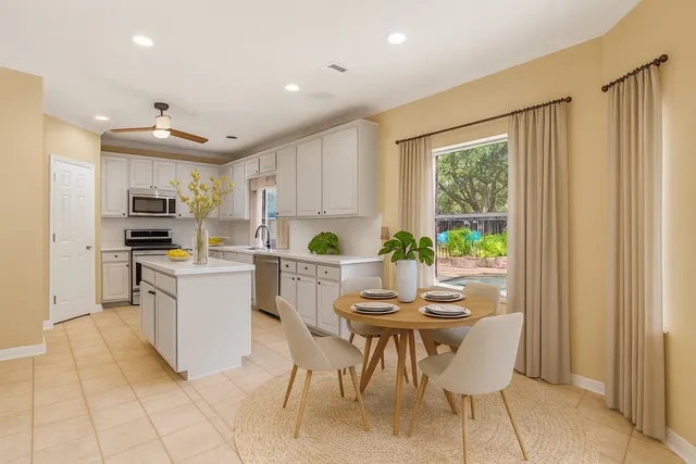 a kitchen with kitchen island wooden cabinets and counter space