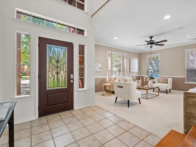 a living room with furniture and a window