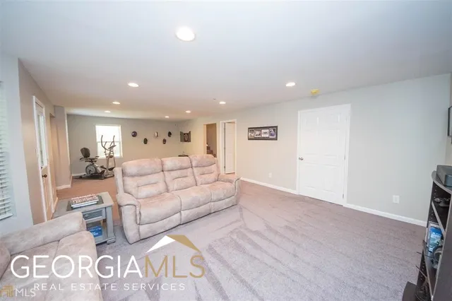 a large white room with a white couch