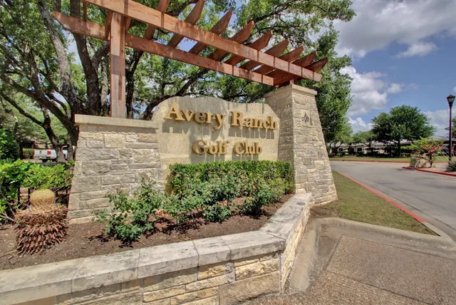 a view of a wooden deck with a yard