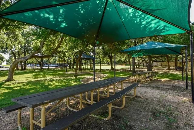 a view of a street with an outdoor seating