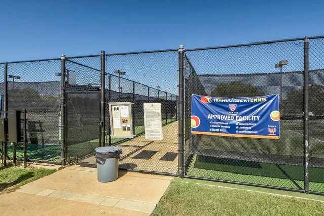 a view of a park with large trees