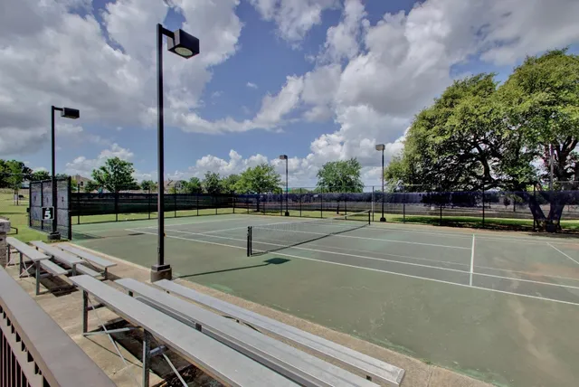 a view of a swimming pool with an outdoor seating