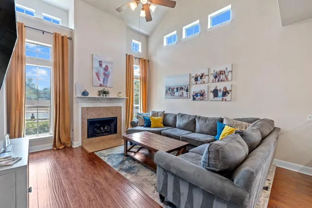 a living room with furniture and a fireplace