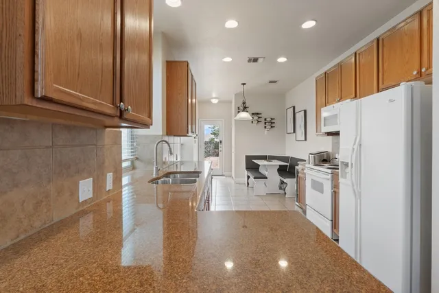 a kitchen with stainless steel appliances refrigerator and cabinets