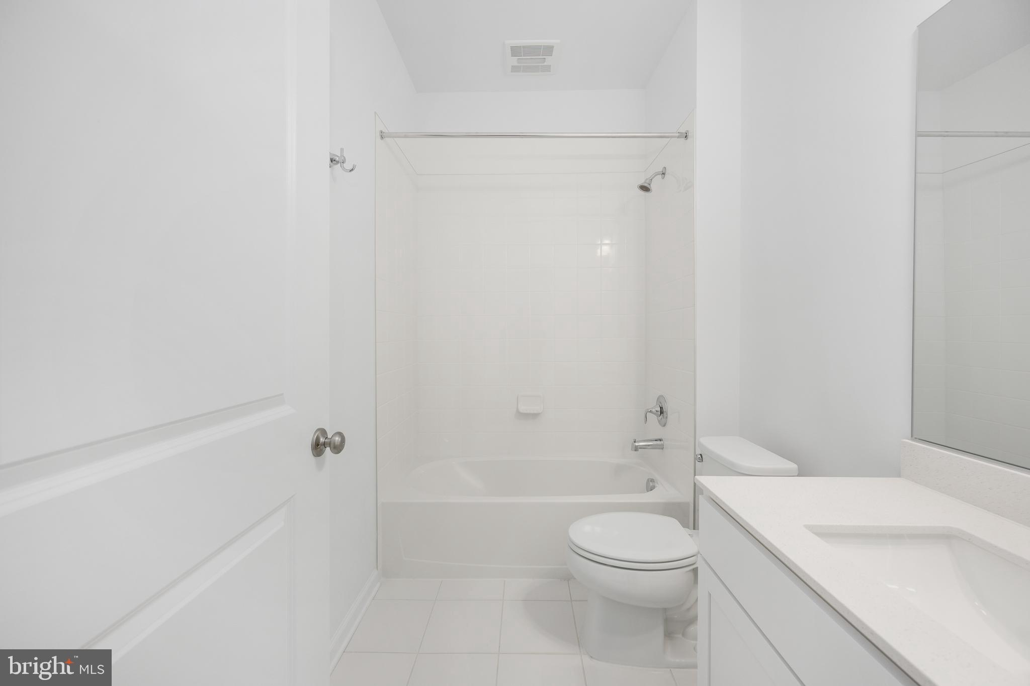 10157 Queens Way Manassas, VA 20110 - Photo 15 of 27 a bathroom with a sink a toilet and shower