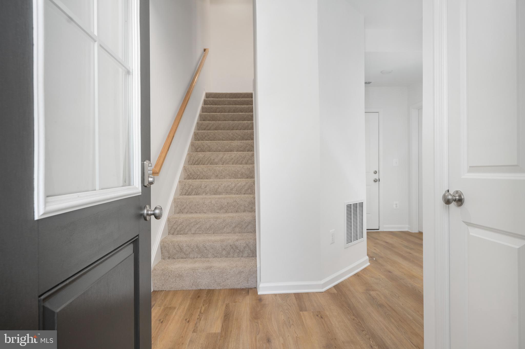 10157 Queens Way Manassas, VA 20110 - Photo 3 of 27 a view of entryway with wooden floor