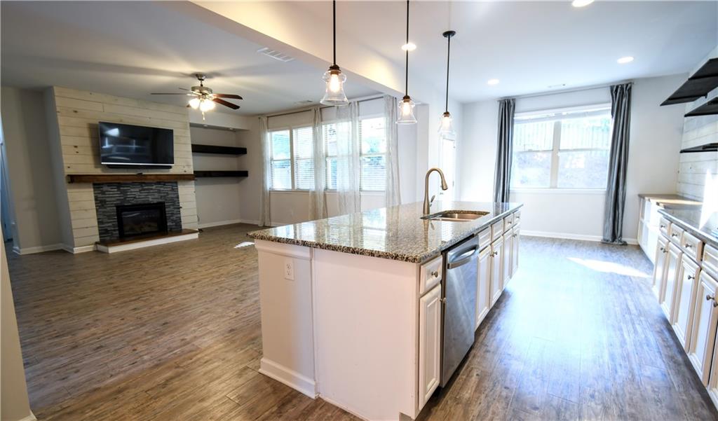 5250 Whisper Point Boulevard Cumming, GA 30028 - Photo 14 of 55 a kitchen with sink stove and refrigerator