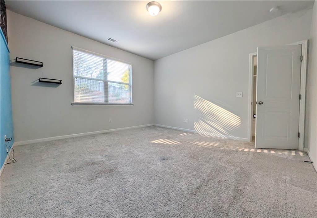 5250 Whisper Point Boulevard Cumming, GA 30028 - Photo 24 of 55 a view of an empty room with a window