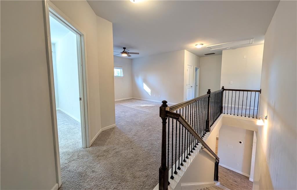 5250 Whisper Point Boulevard Cumming, GA 30028 - Photo 31 of 55 a view of a hallway with staircase