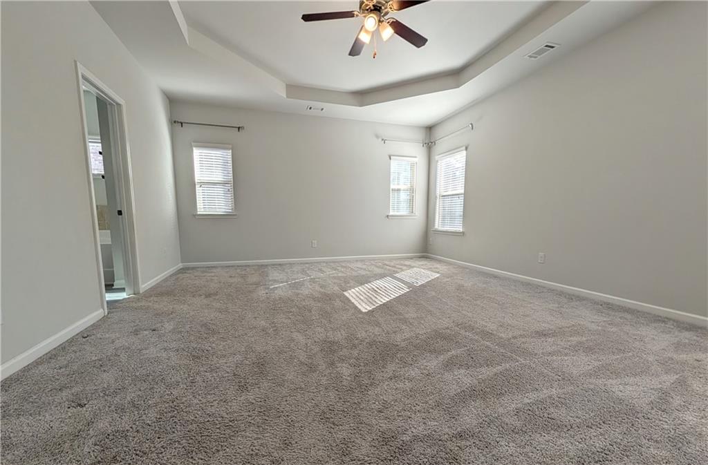 5250 Whisper Point Boulevard Cumming, GA 30028 - Photo 33 of 55 a view of a livingroom with a ceiling fan and window