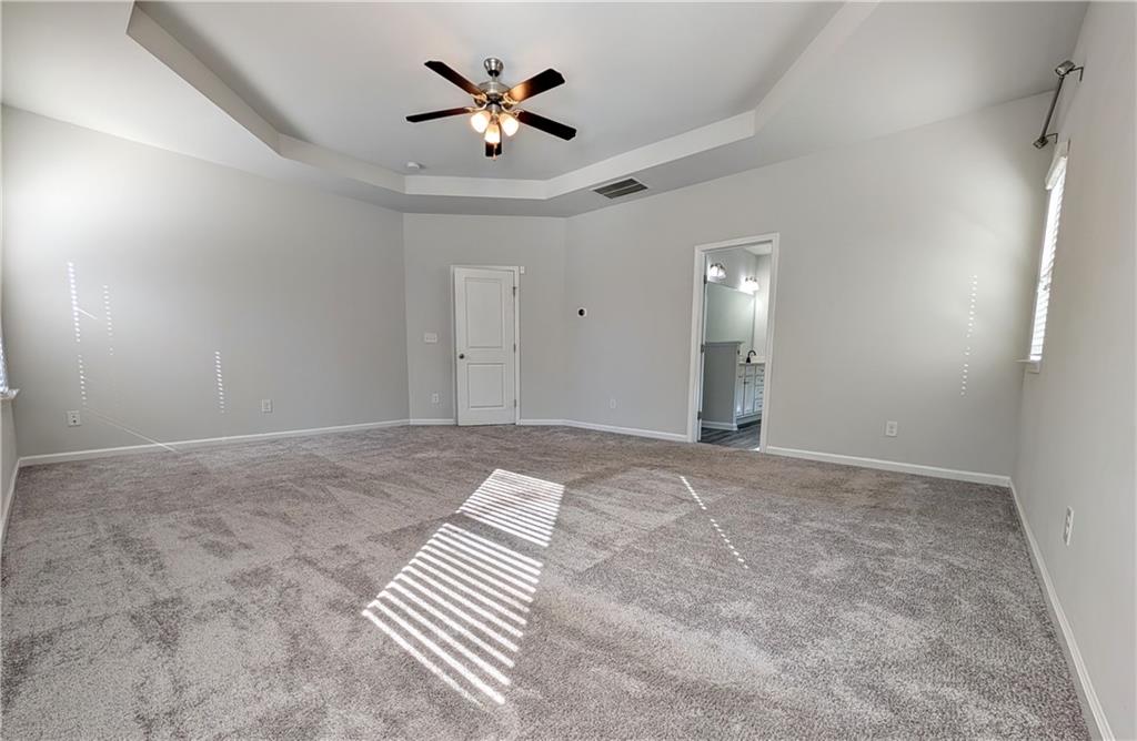 5250 Whisper Point Boulevard Cumming, GA 30028 - Photo 35 of 55 an empty room with a bathroom