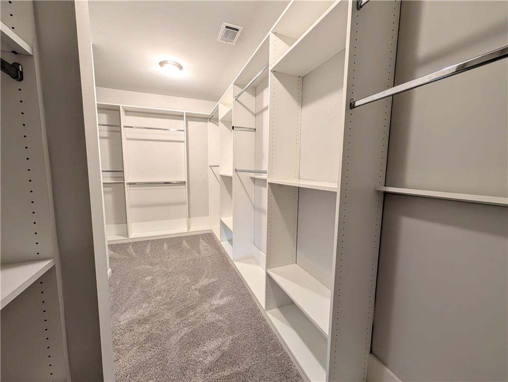 5250 Whisper Point Boulevard Cumming, GA 30028 - Photo 41 of 55 a view of walk in closet with empty racks