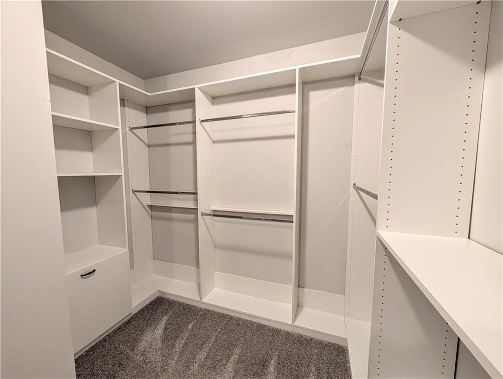 5250 Whisper Point Boulevard Cumming, GA 30028 - Photo 42 of 55 a view of walk in closet with empty racks