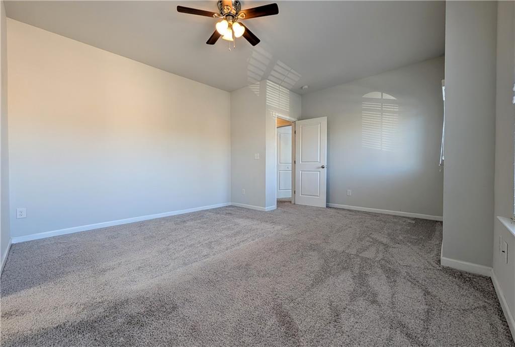 5250 Whisper Point Boulevard Cumming, GA 30028 - Photo 45 of 55 a view of an empty room with a chandelier fan