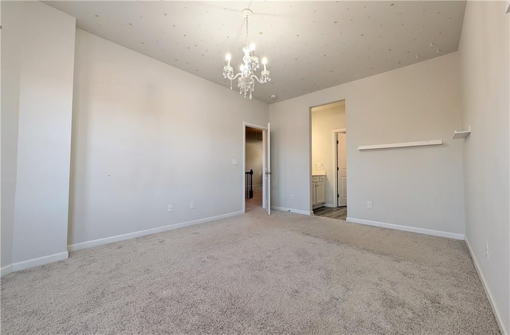 5250 Whisper Point Boulevard Cumming, GA 30028 - Photo 48 of 55 a view of a chandelier in big room and chandelier