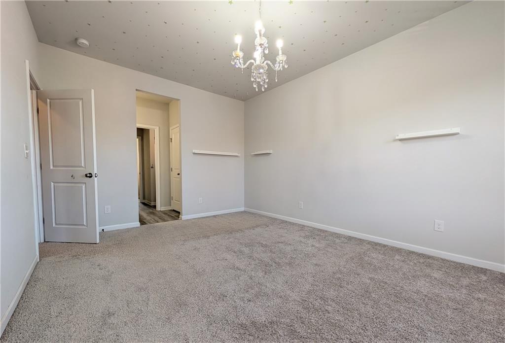 5250 Whisper Point Boulevard Cumming, GA 30028 - Photo 49 of 55 a view of a chandelier in big room and chandelier