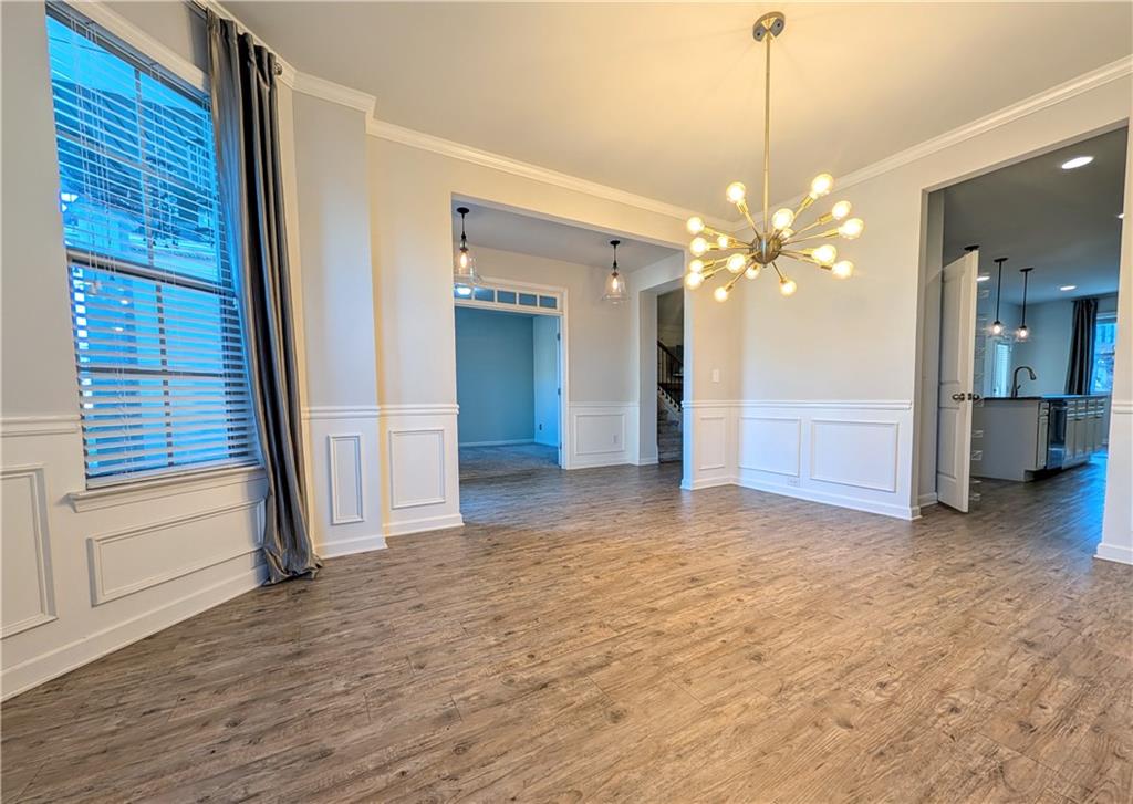 5250 Whisper Point Boulevard Cumming, GA 30028 - Photo 6 of 55 a view of a livingroom with a chandelier