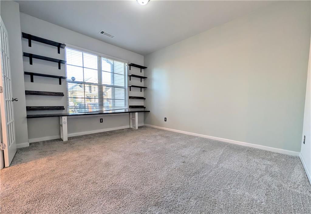 5250 Whisper Point Boulevard Cumming, GA 30028 - Photo 9 of 55 a view of an empty room with a window