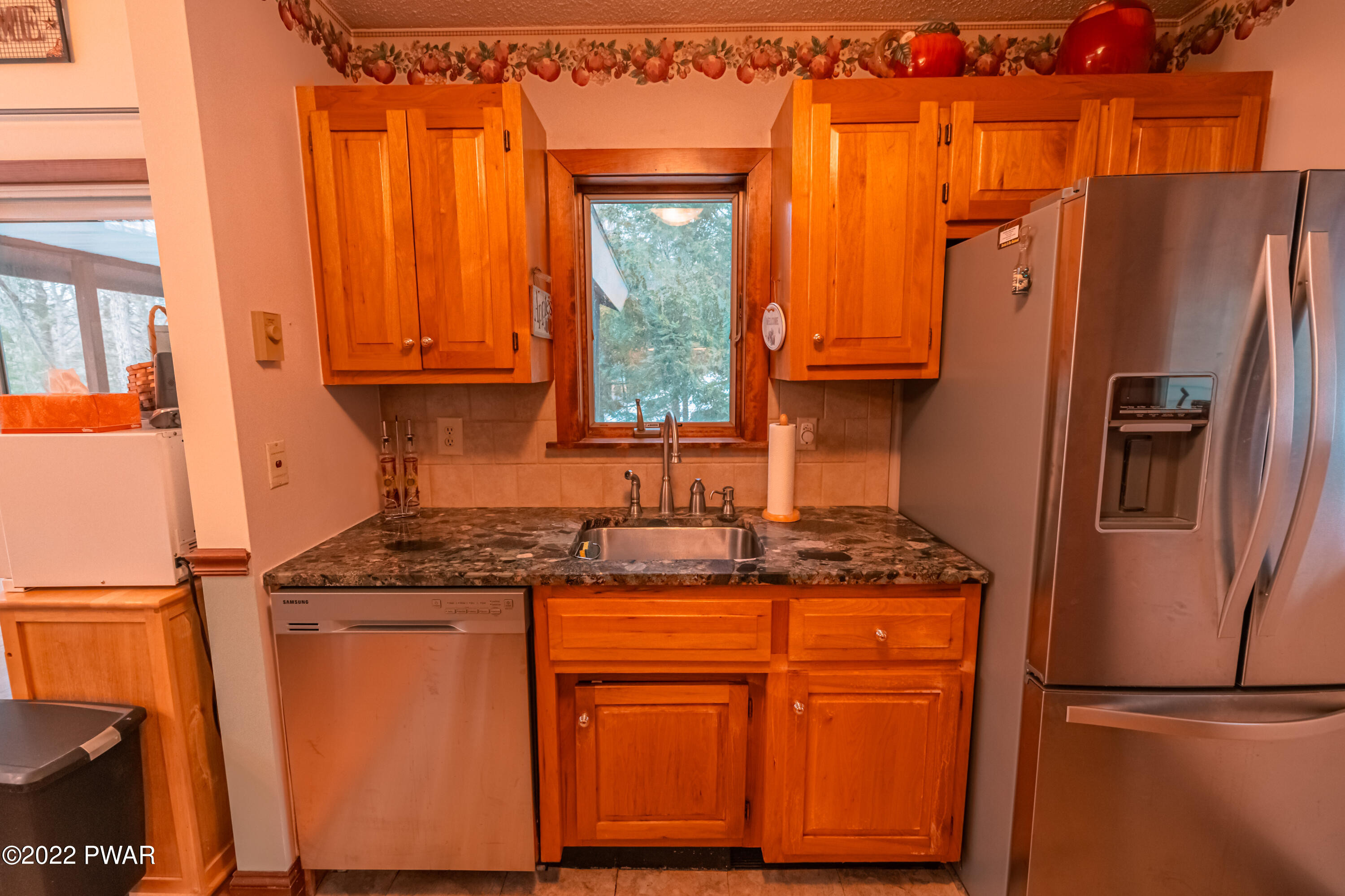 4141 Winchester Way Bushkill, PA 18324 - Photo 20 of 75 a kitchen with granite countertop a refrigerator and a sink