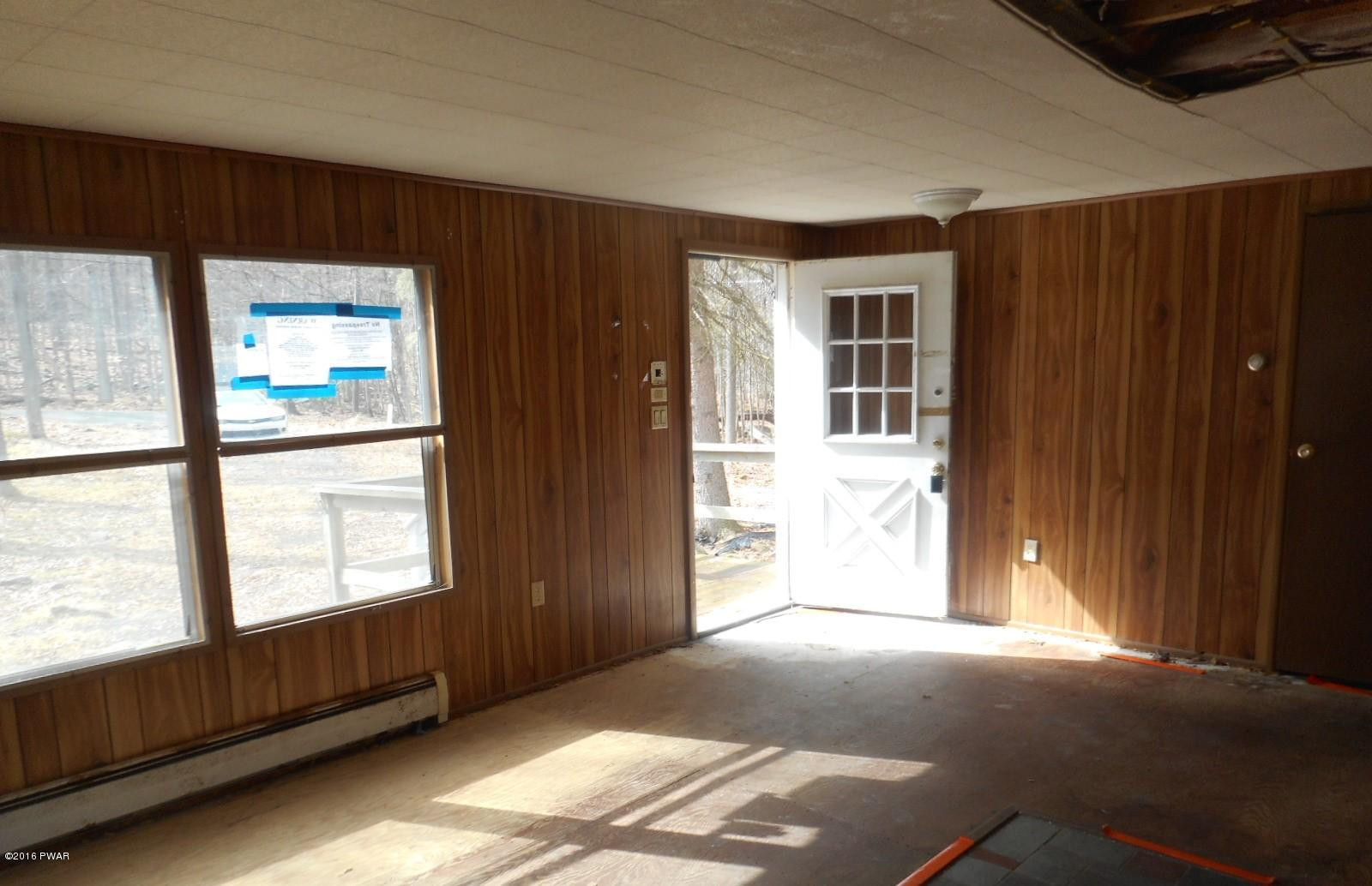 544 Hummingbird Lane Hawley, PA 18428 - Photo 9 of 16 a view of an empty room with a window