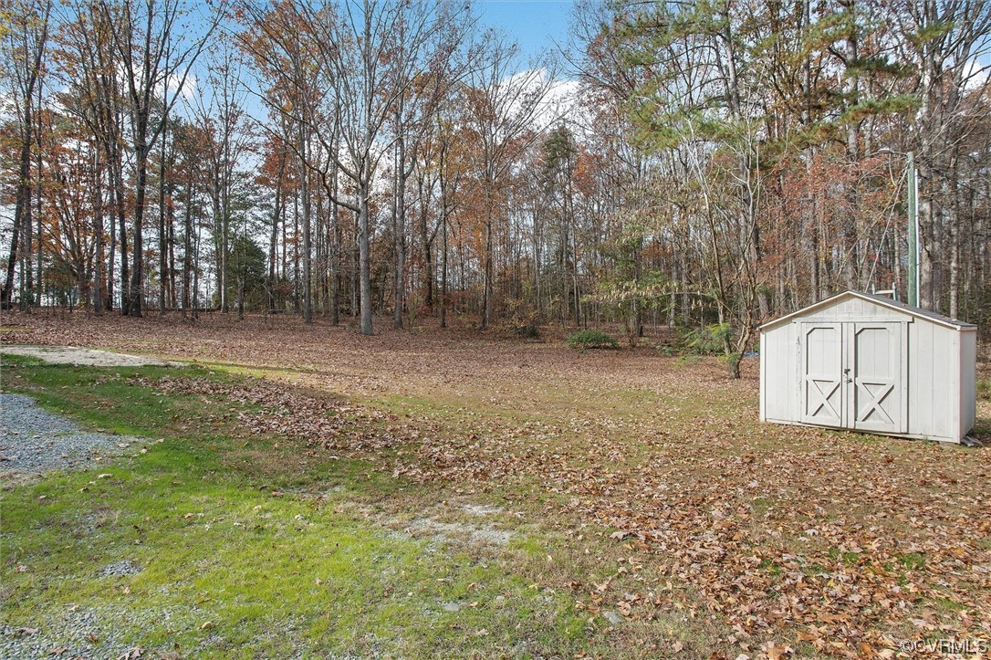 13506 Verdon Road Ruther Glen, VA 22546 - Photo 25 of 27 a view of backyard with tree