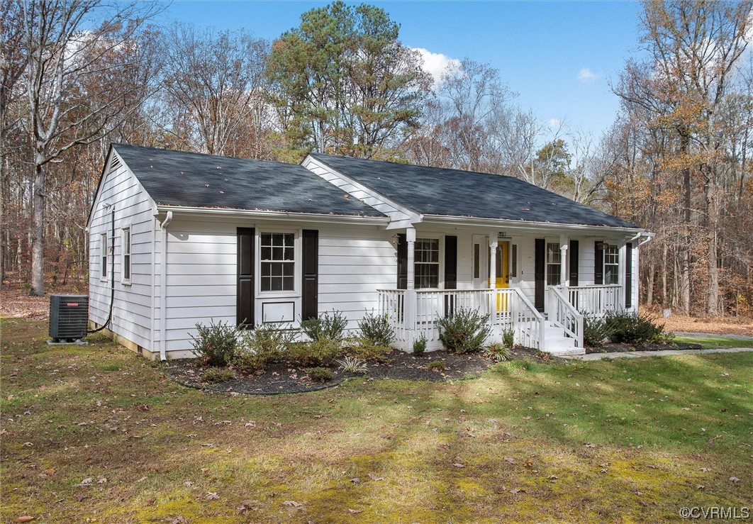 13506 Verdon Road Ruther Glen, VA 22546 - Photo 3 of 27 a front view of a house with yard and outdoor seating