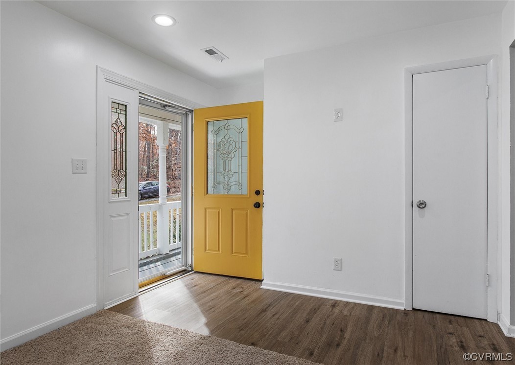 13506 Verdon Road Ruther Glen, VA 22546 - Photo 5 of 27 an empty room with wooden floor and windows