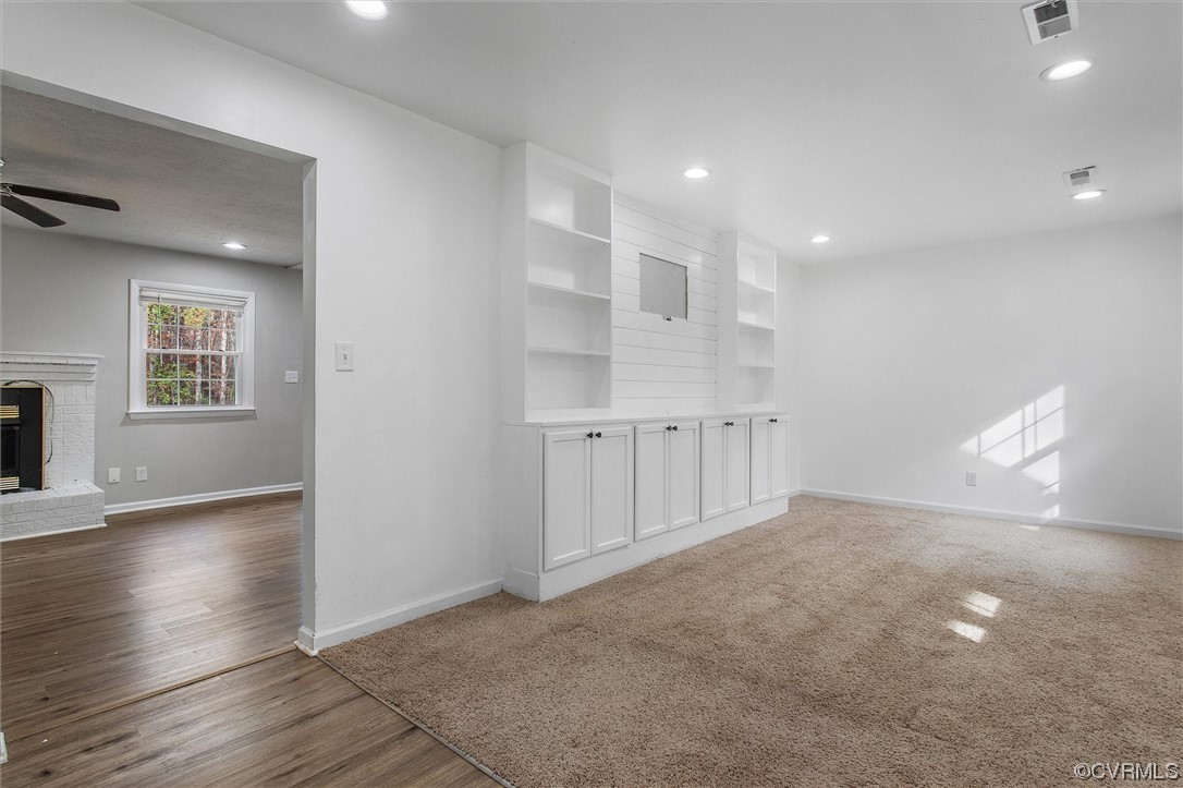 13506 Verdon Road Ruther Glen, VA 22546 - Photo 6 of 27 an empty room with wooden floor and windows