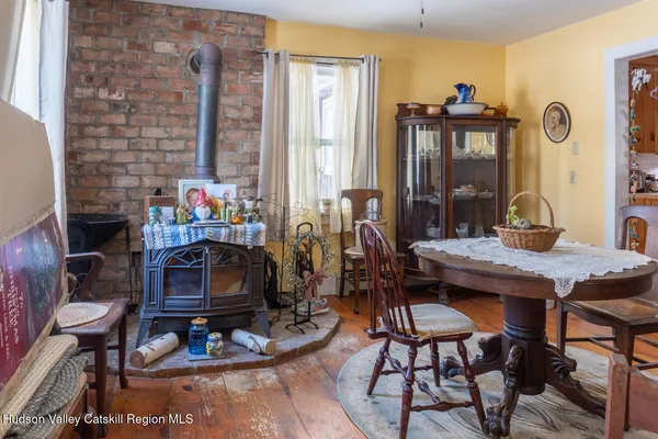 a room with furniture a window and a fireplace