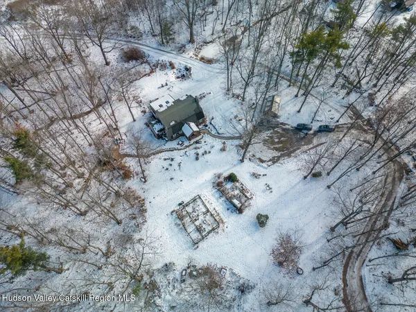 a view of a lake with a tree in the background