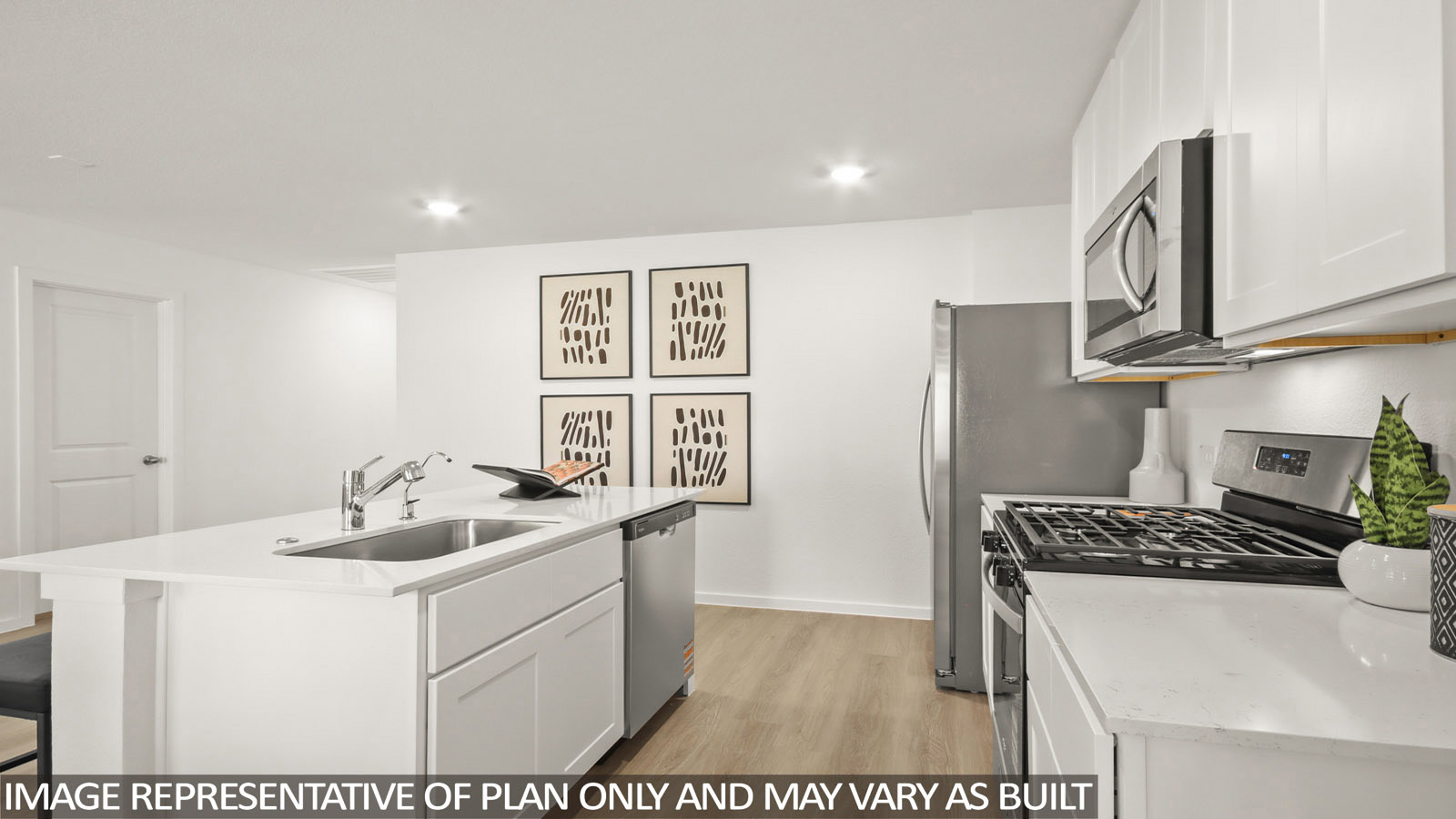 181 Baby Calf Roping Road Jarrell, TX 76537 - Photo 4 of 23 a kitchen that has a sink and a stove in it