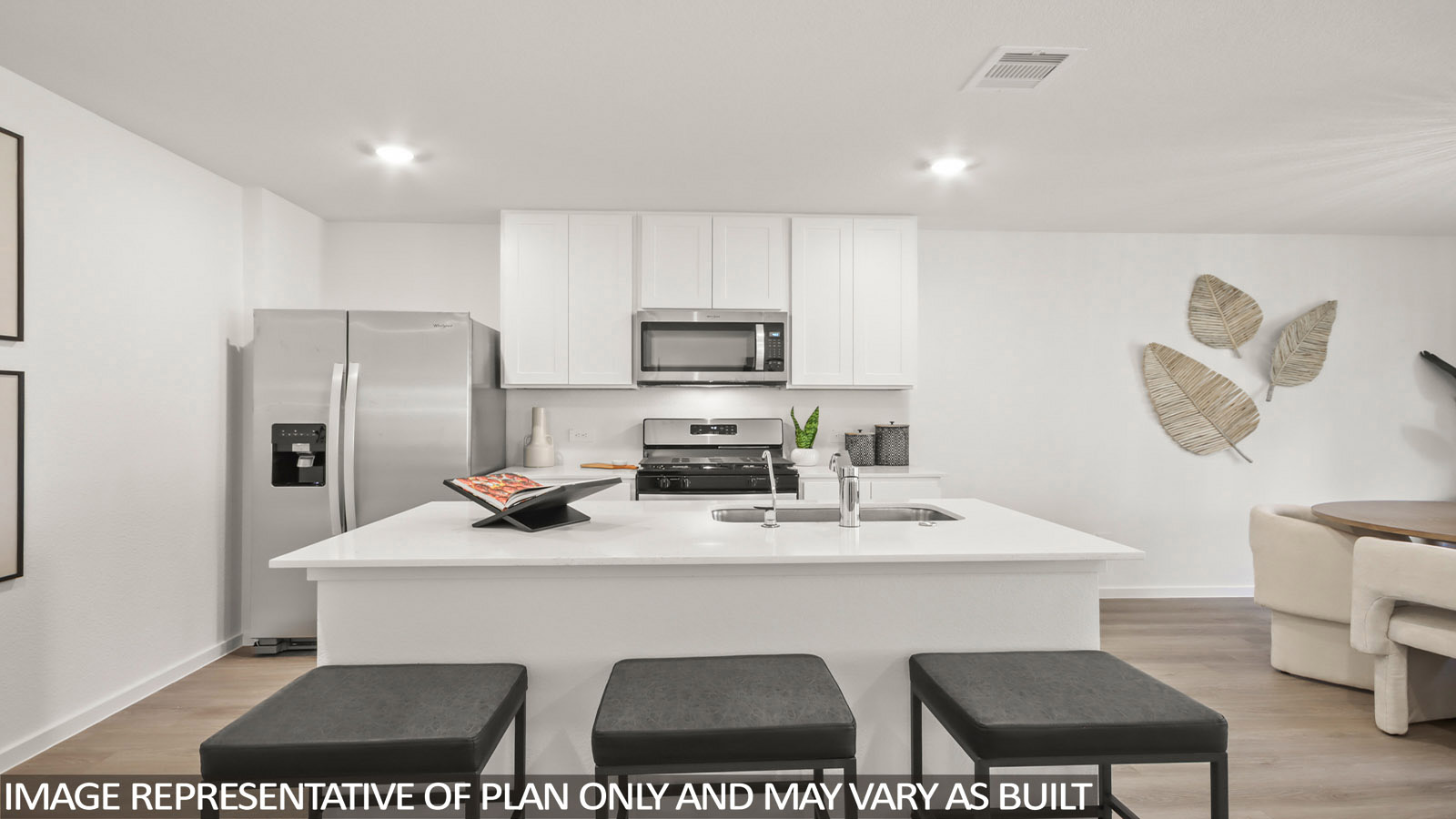 181 Baby Calf Roping Road Jarrell, TX 76537 - Photo 5 of 23 a kitchen with stainless steel appliances a sink counter space and a refrigerator