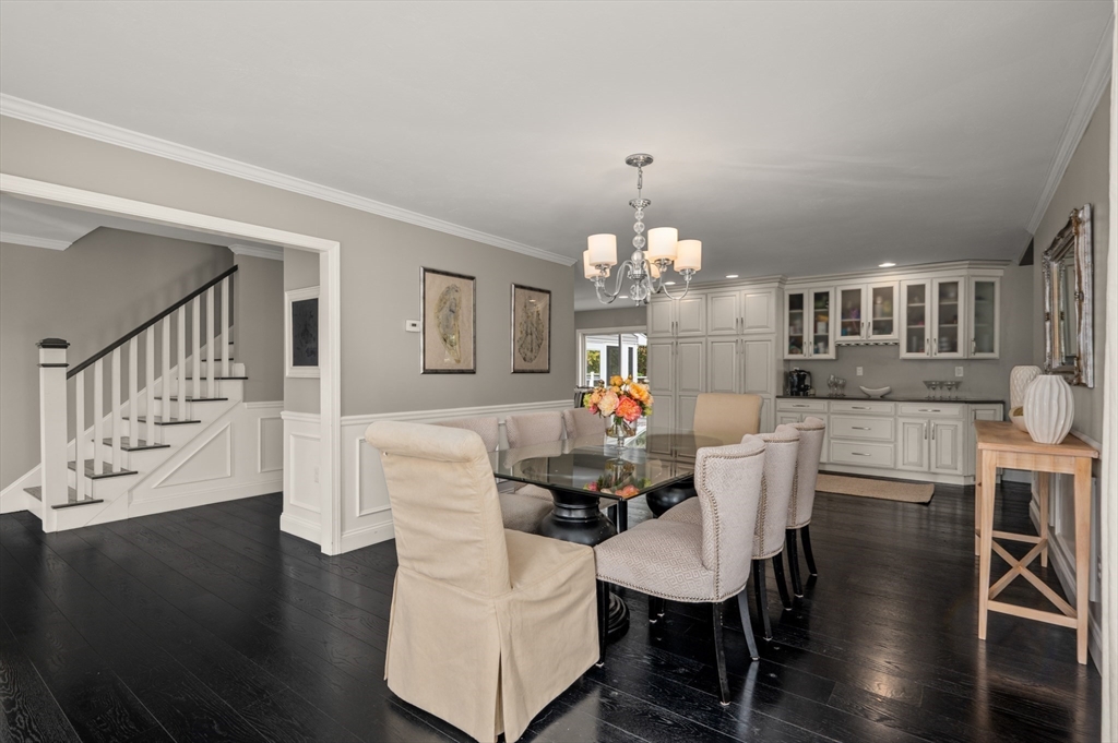16 Autumn Woods Road Salem, NH 03079 - Photo 11 of 29 a view of a dining room with furniture a chandelier and wooden floor