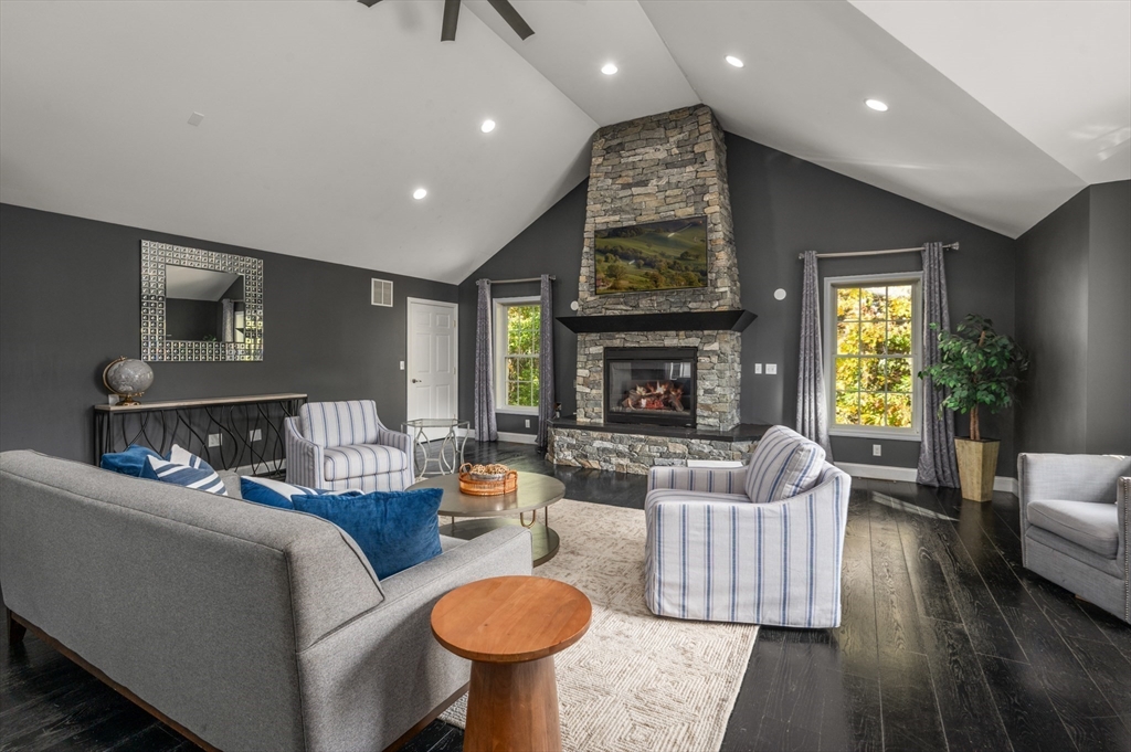 16 Autumn Woods Road Salem, NH 03079 - Photo 7 of 29 a living room with furniture and a fireplace