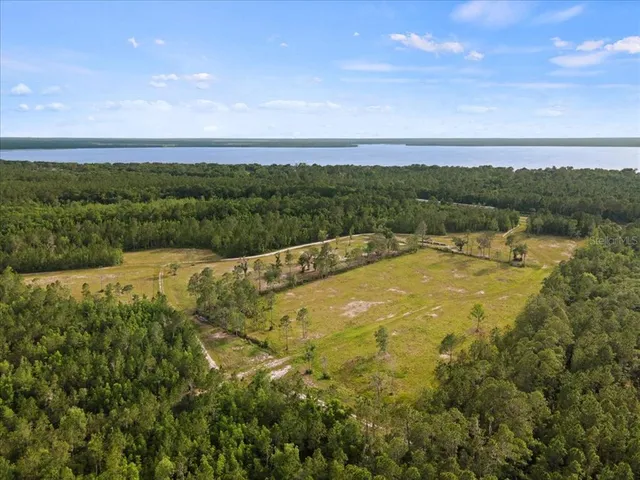 a view of a lake with a yard