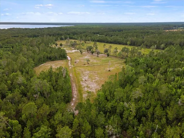 a view of a lake with houses in the back