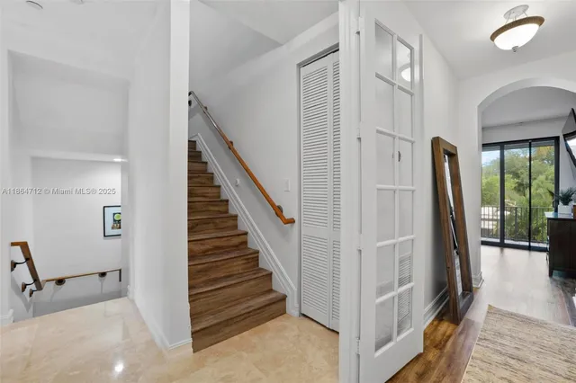 a view of a hallway with staircase
