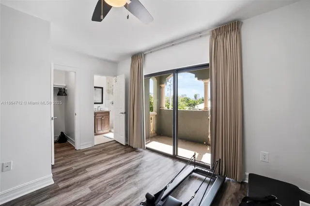 a view of room with window and wooden floor