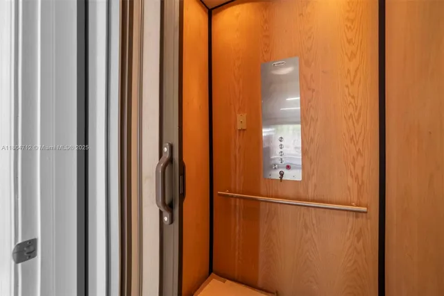 a view of a bathroom with mirror