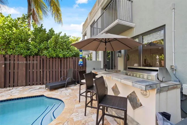 a patio with a table and chairs