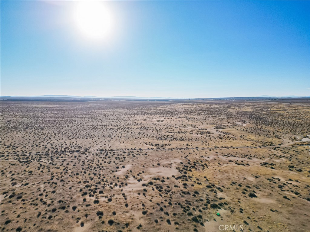 10000 Kramer Station Road Boron, CA 93516 - Photo 5 of 47 a view of a dry yard with wooden floor
